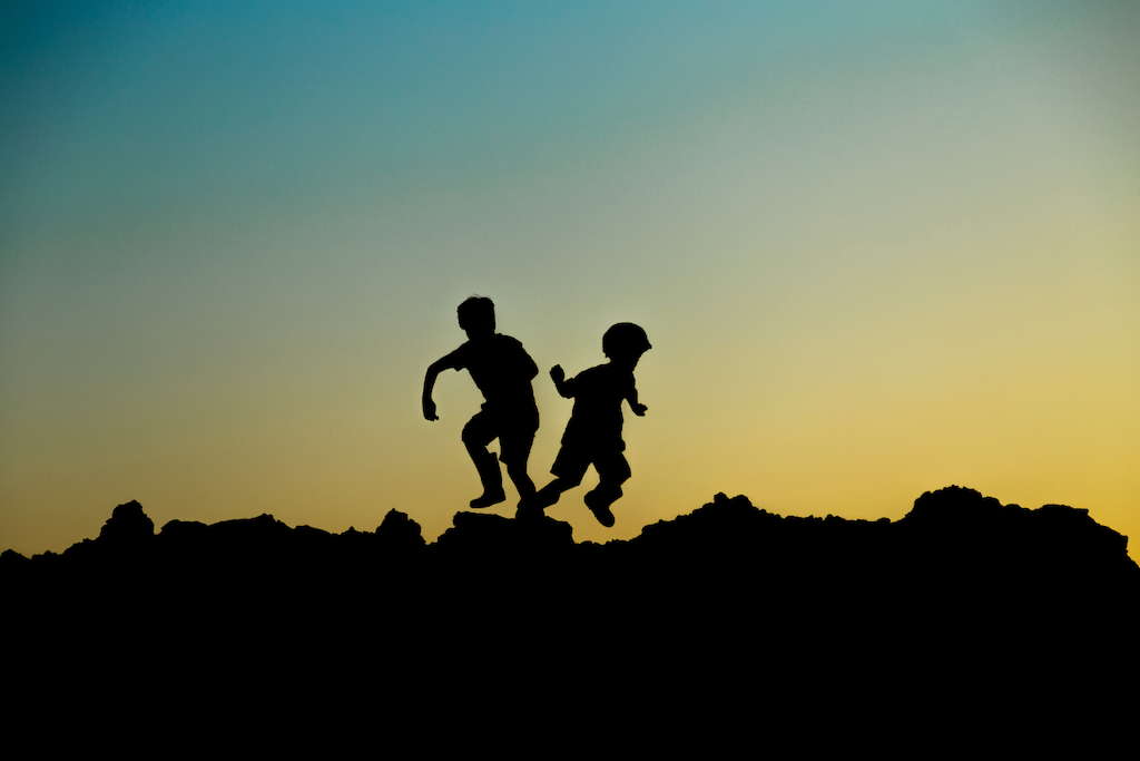 kids running in the sunset