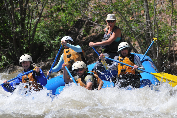 people rafting in white water