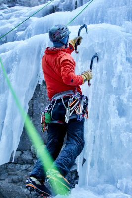 ice climber climbing up an ice route