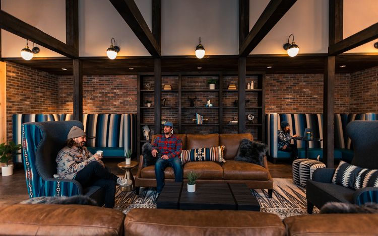 Two men sitting in the great room at the bivvi