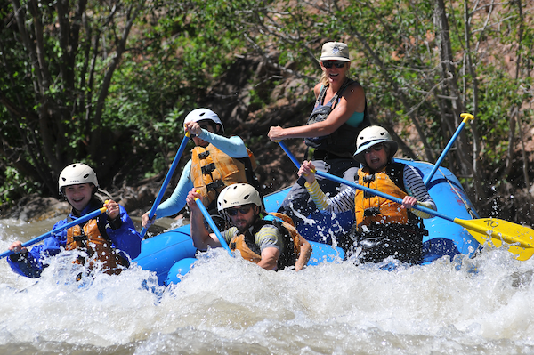 family rafting in a river