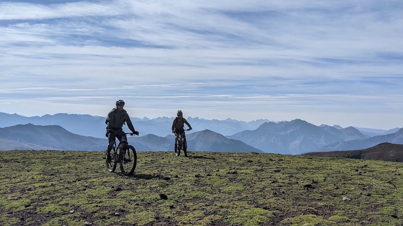 Mountain bikers with mountains in the background