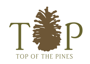 top of the pines logo with pine cone