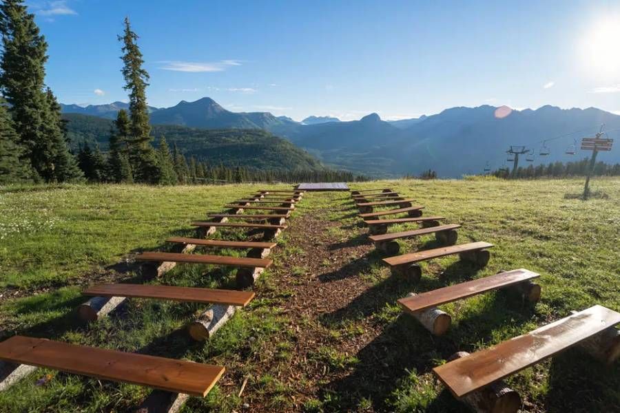 Wooden benches on top of a mountain